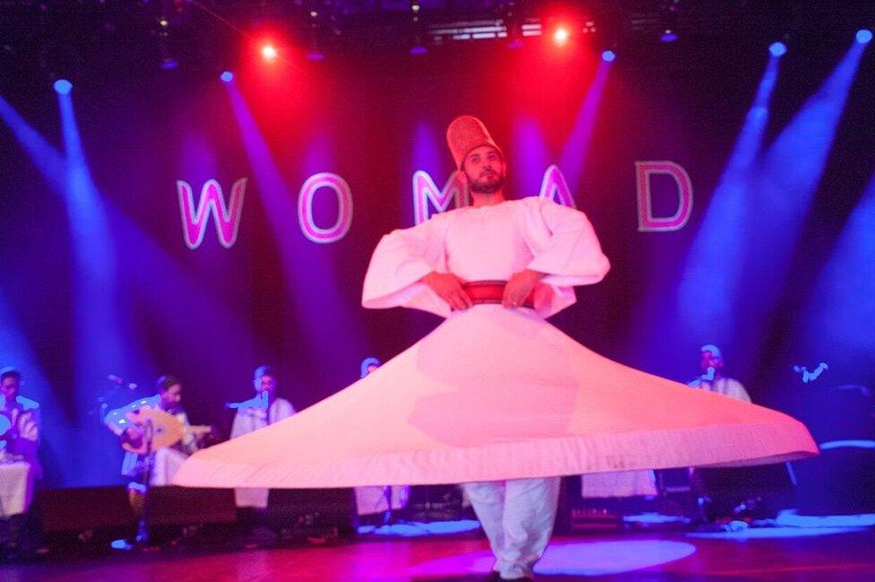 A whirling dervish dances himself dizzy while Noureddine Khourchid, accompanied by six other Syrian singer-musicians, performs a series of sacred Sufi songs known as "inshads".