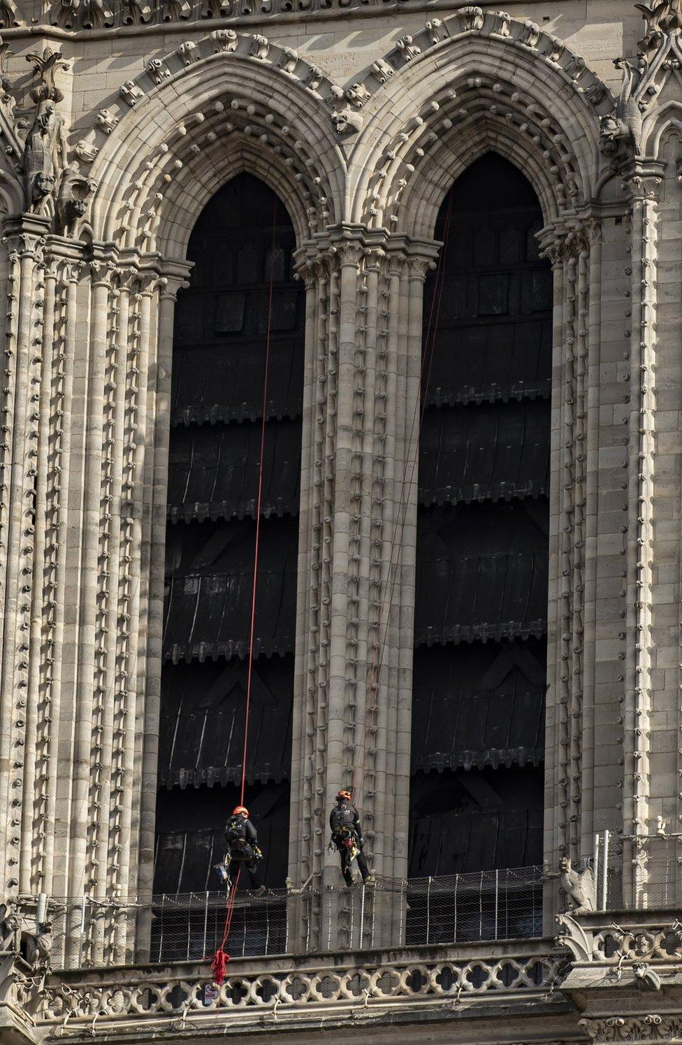 Workers are seen restoring the Notre-Dame cathedral