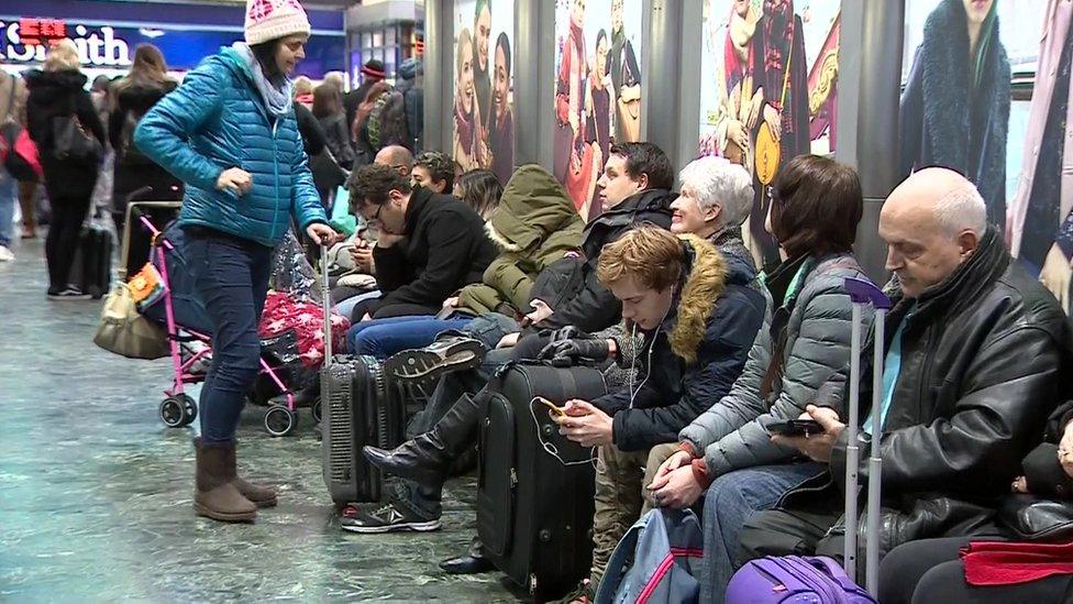 Passengers await news at London Euston