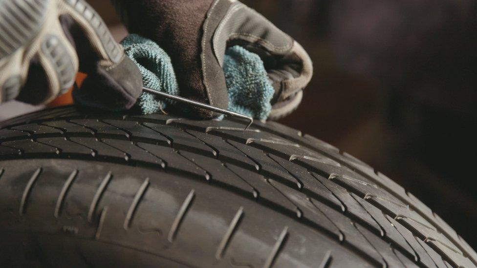 Car tyre being tested