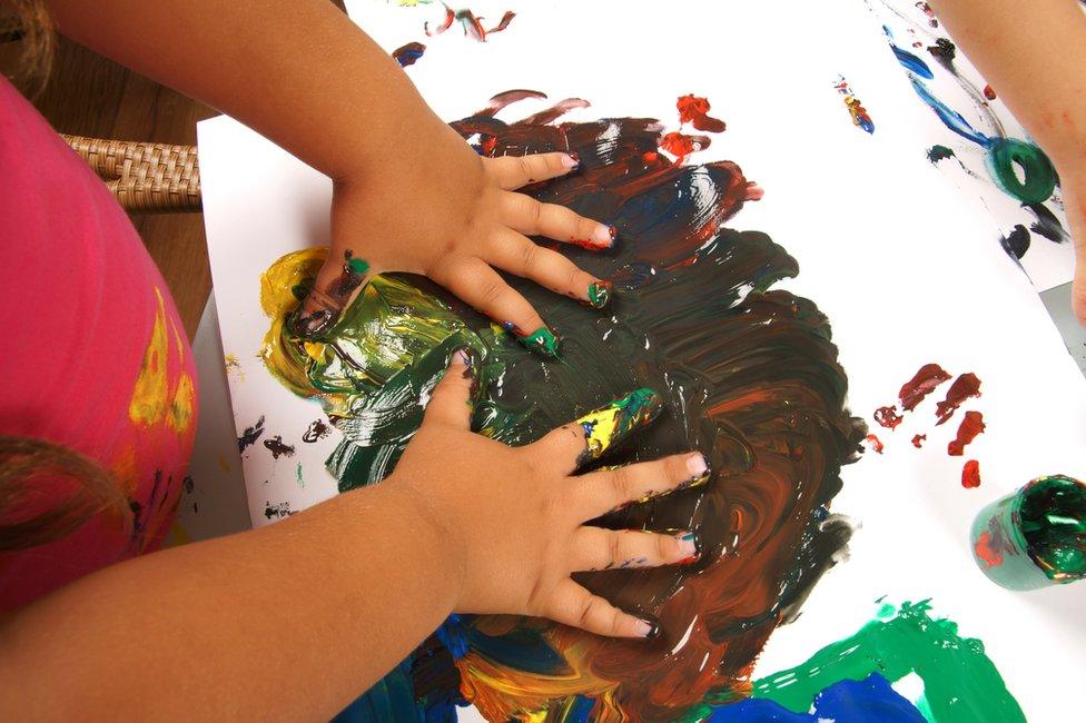 Child finger painting