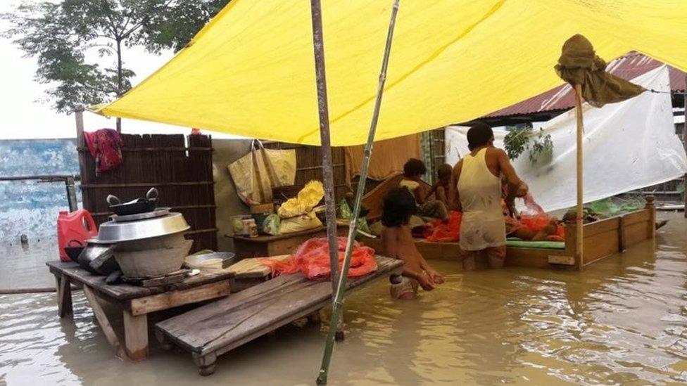 A displaced family in a makeshift shelter in Dorang district of Assam state in India