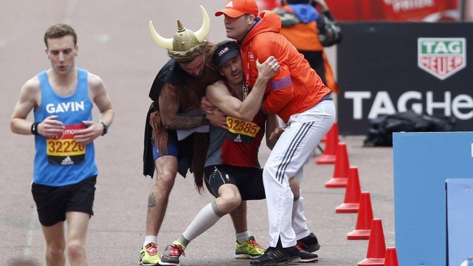 A runner collapsing before the London Marathon finish line