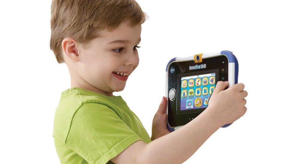 A child using a Vtech toy