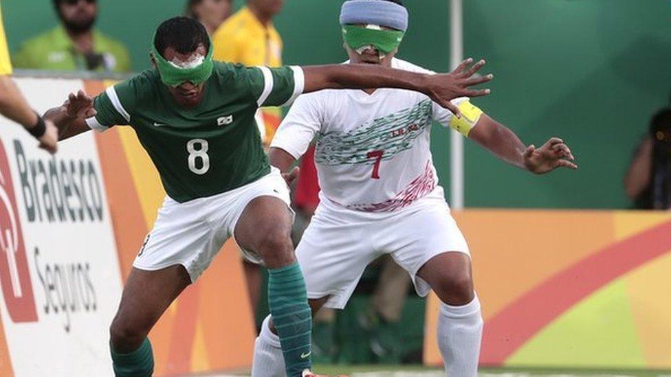 Nonato of Brazil fights for the ball with Hossein Rajabpour of Iran