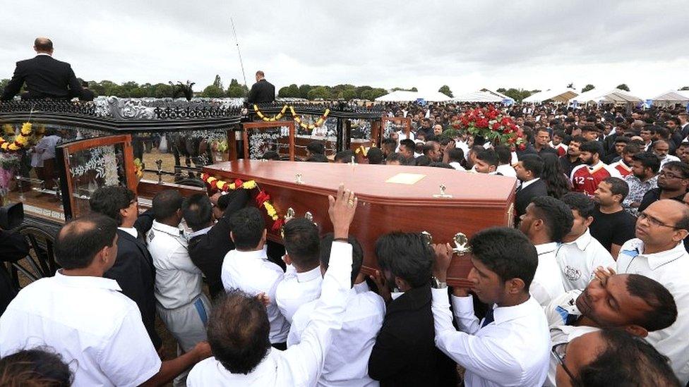 The coffins of Kenugen Saththiyanathan and his brother Kobikanthan Saththiyanathan are loaded on to horse drawn carriages