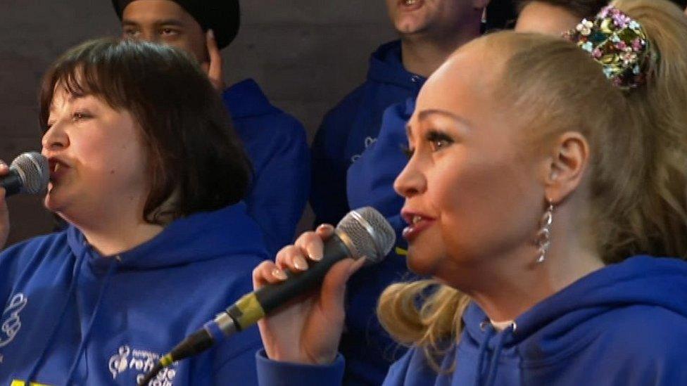 Sonia (right) singing with the European Youth Refugee Choir