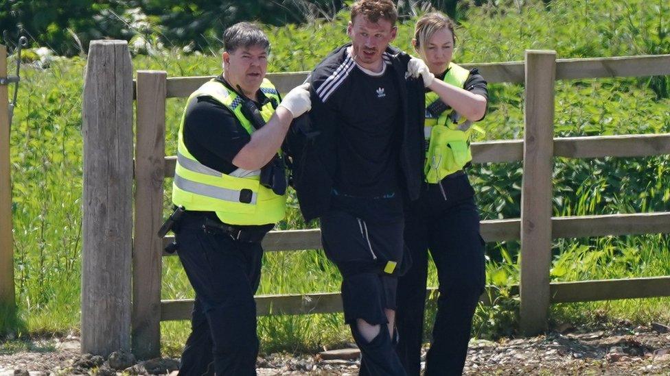 Image of Daniel Boulton being apprehended by police