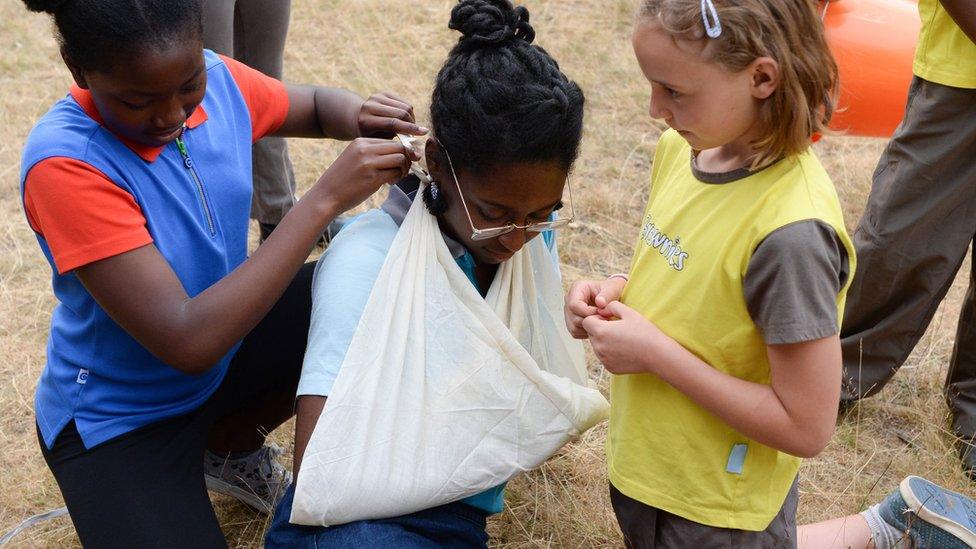 Brownies and Guides doing a First Aid activity