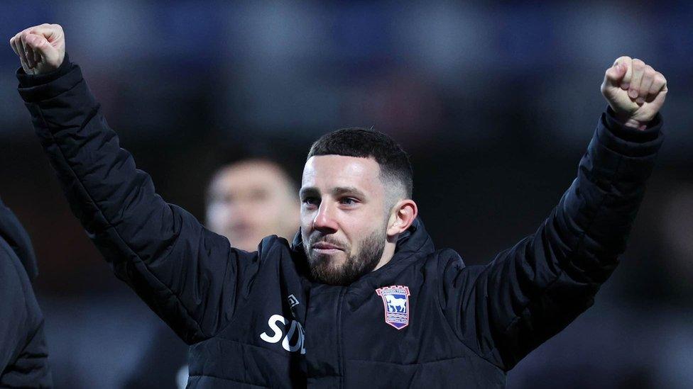 Conor Chaplin celebrates, wielding both hands in the air following the dramatic win over Southampton in April