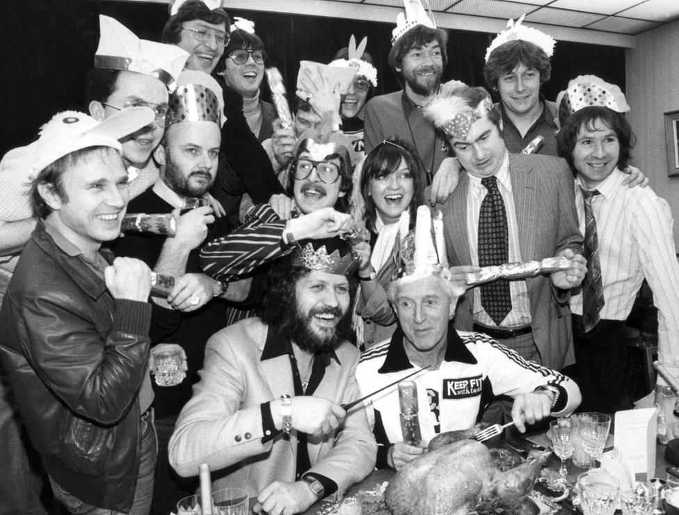 Radio 1 Christmas party with Dave Lee Travis, Jimmy Savile, Simon Bates, Paul Burnett, Andy Peebles, Peter Powell, Mike Read, John Peel, Anne Nightingale, Tommy Vance, Paul Gambaccini, Steve Wright, Adrian Love, Adrian Juste, and Richard Skinner