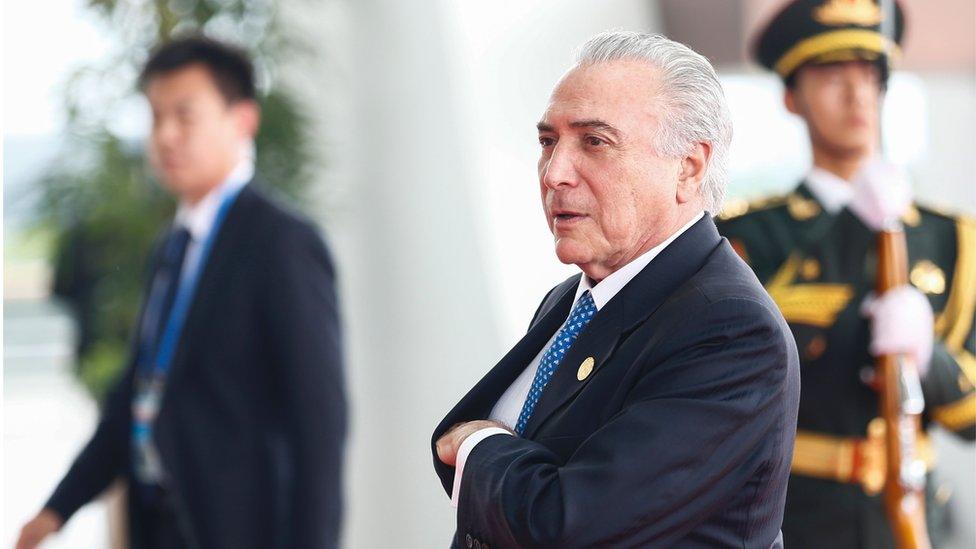 Michel Temer walking up steps in Huangzou, China