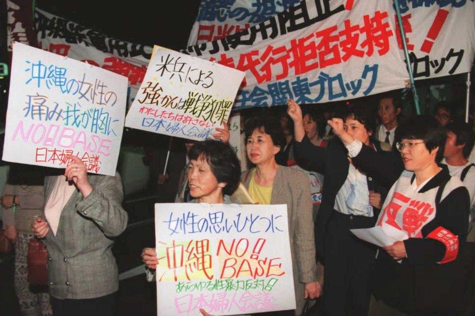 Women protesting against the US presence in 1995