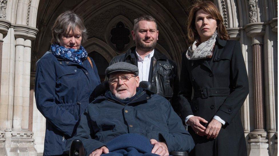 Noel Conway outside The Royal Courts of Justice with his family in 2017