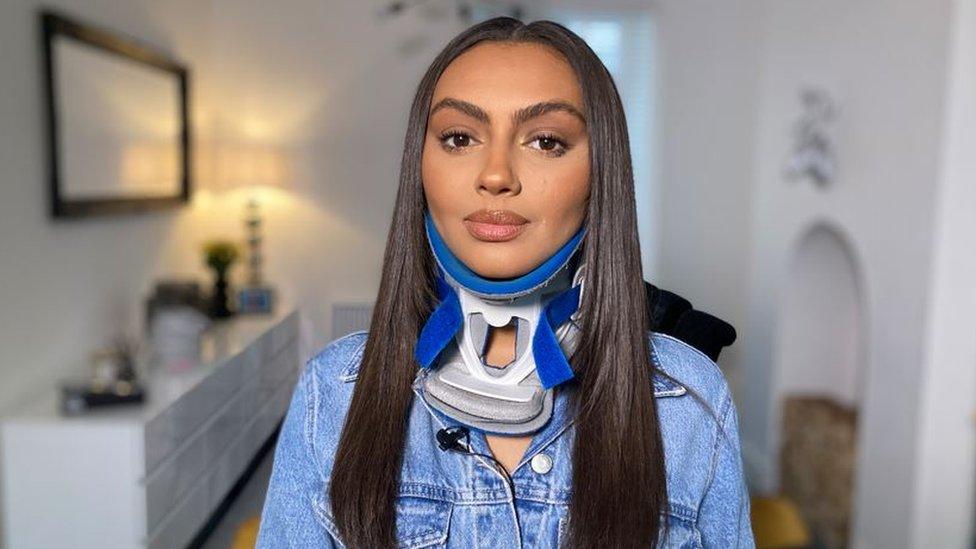 Darcey Corria in a neck brace