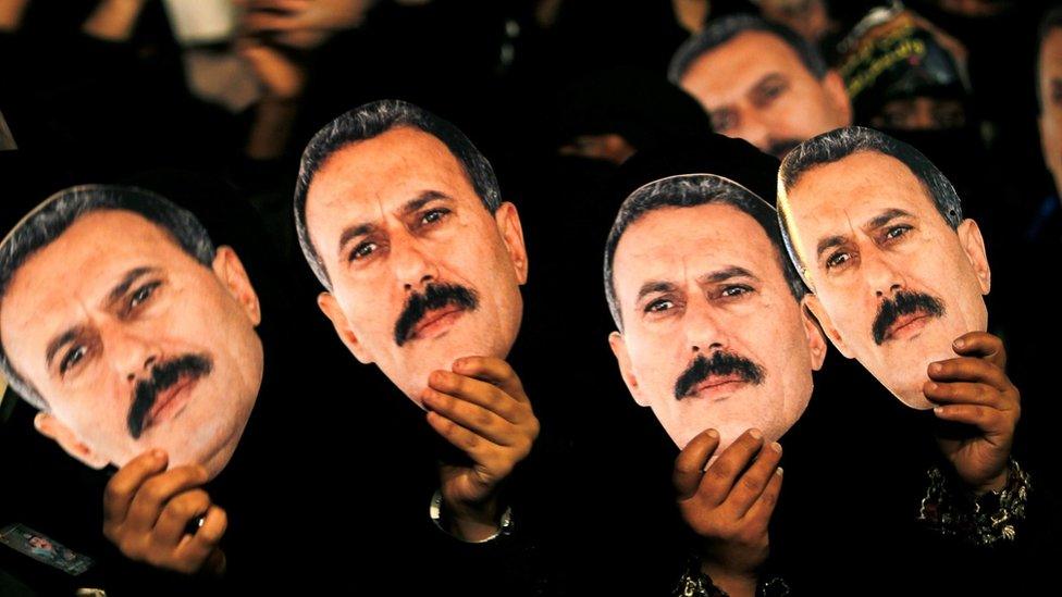 Female supporters of Ali Abdullah Saleh hold up posters during a rally marking his 70th birthday anniversary in Sanaa (23 March 2012)