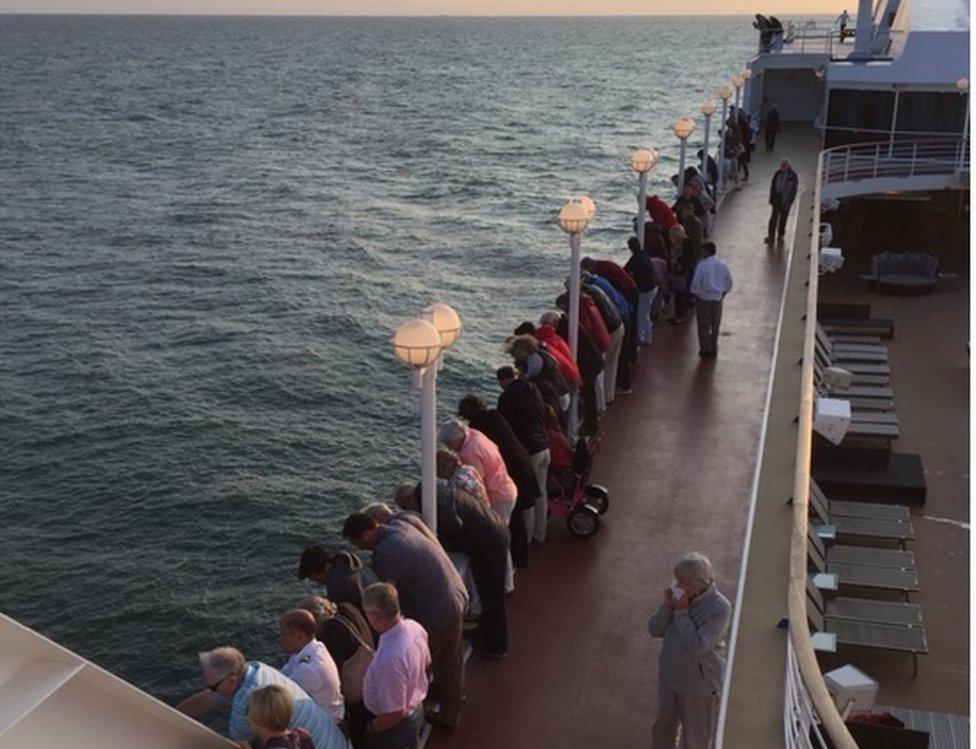 Passengers on The Pacific Princess watch the rescue