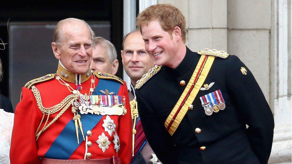 Princes Philip and Harry laughing