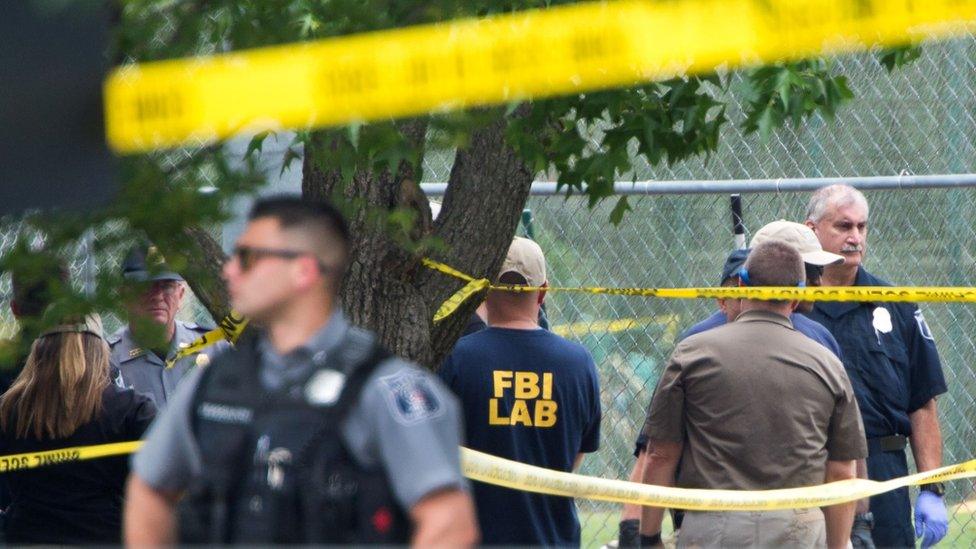 Members of law enforcement gather at the crime scene after a shooting in Alexandria, Virginia on June 14, 2017.