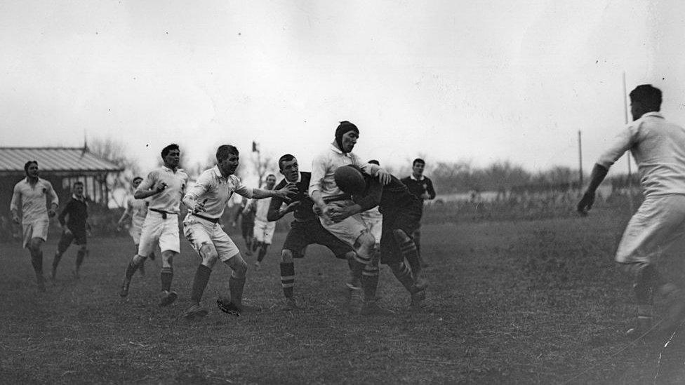 A tackle goes in during England v Wales