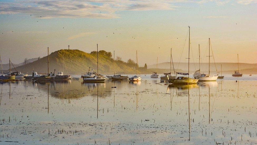 Boats on water reflected