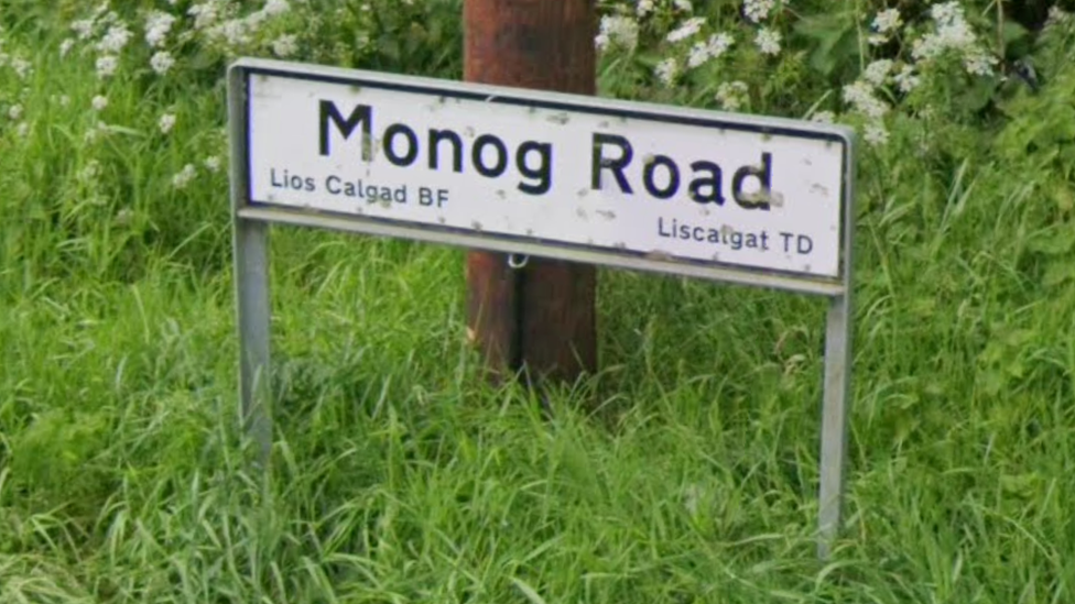 A road sign of Monog Road