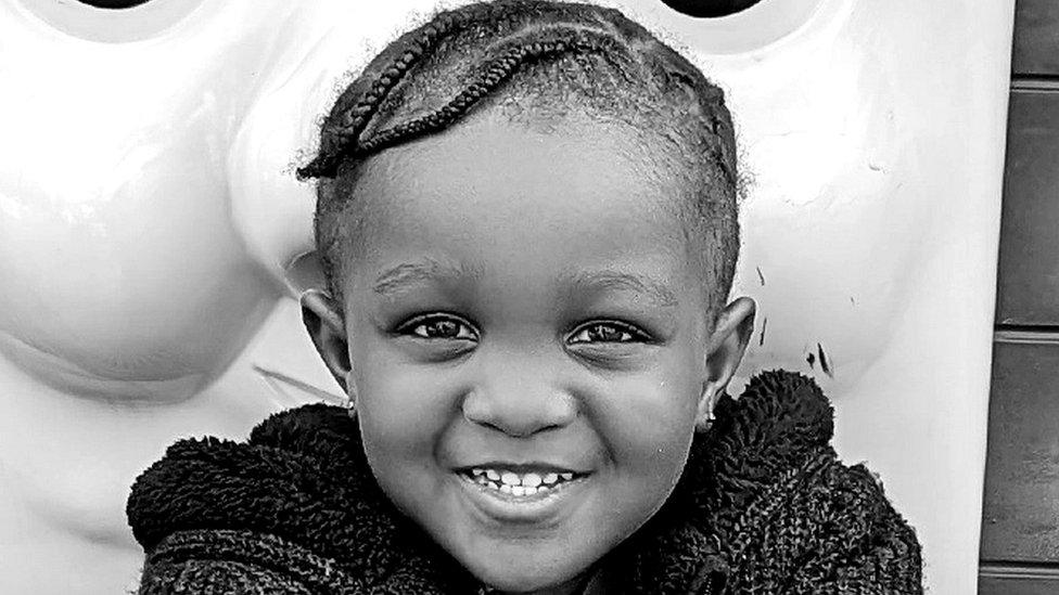 Black and white picture of a young boy