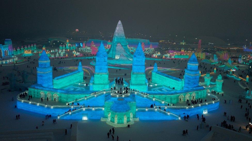 Ice-sculpture-festival-lit-up-at-night.