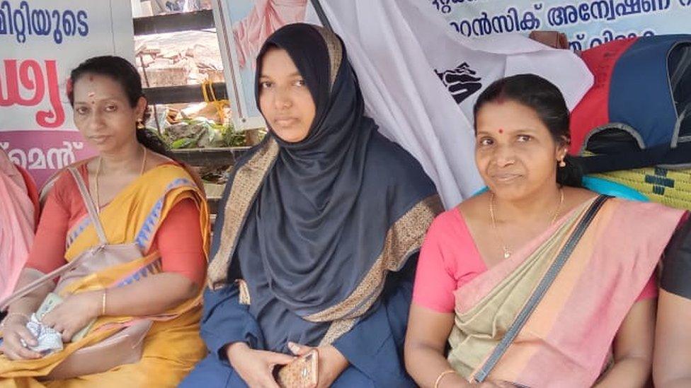 Ms Harshina, sitting in protest with supporters