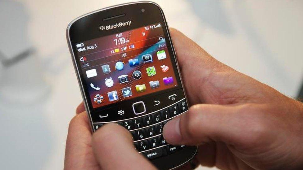 A person uses the new Blackberry Bold 9900 at a release party to promote the BlackBerry OS 7 devices in Toronto 3 August 2011.