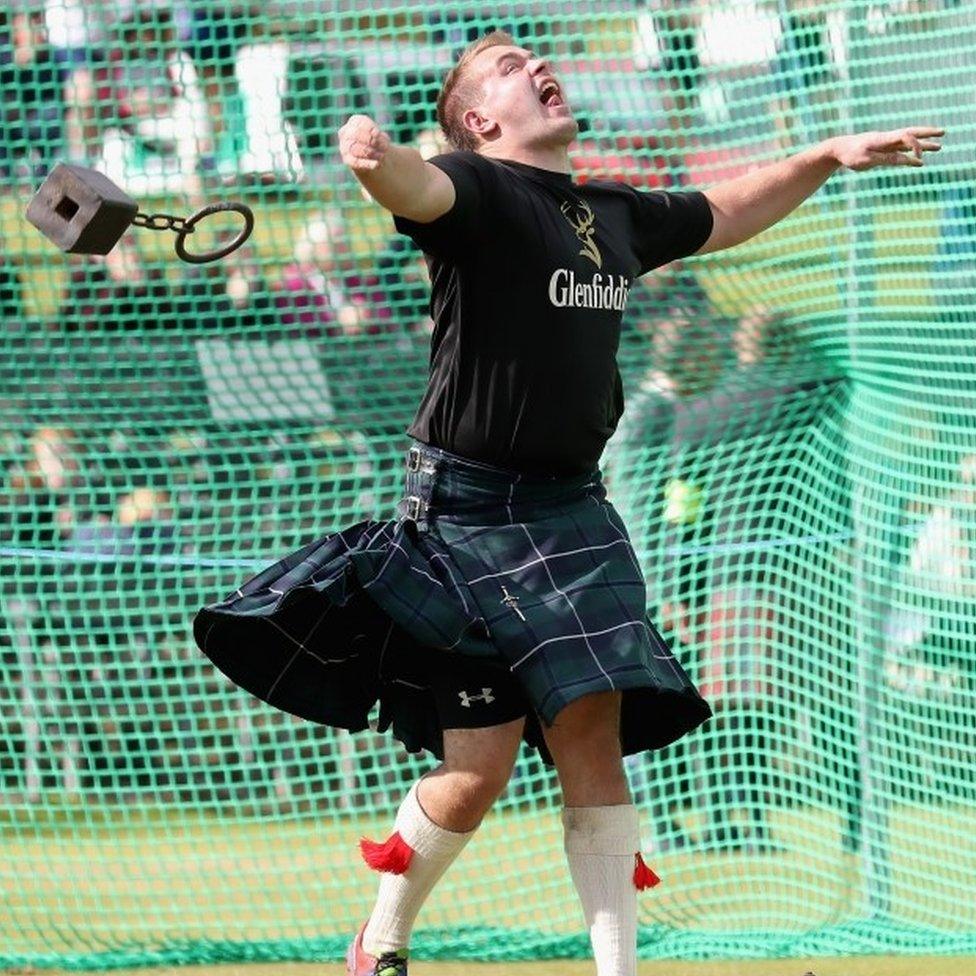 A competitor throwing a weight