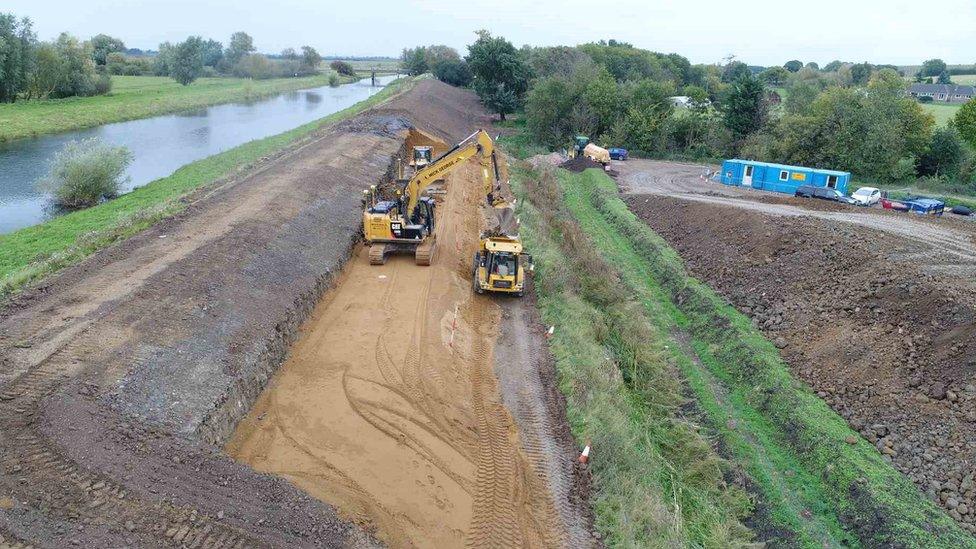 Construction vehicles at work during the project.