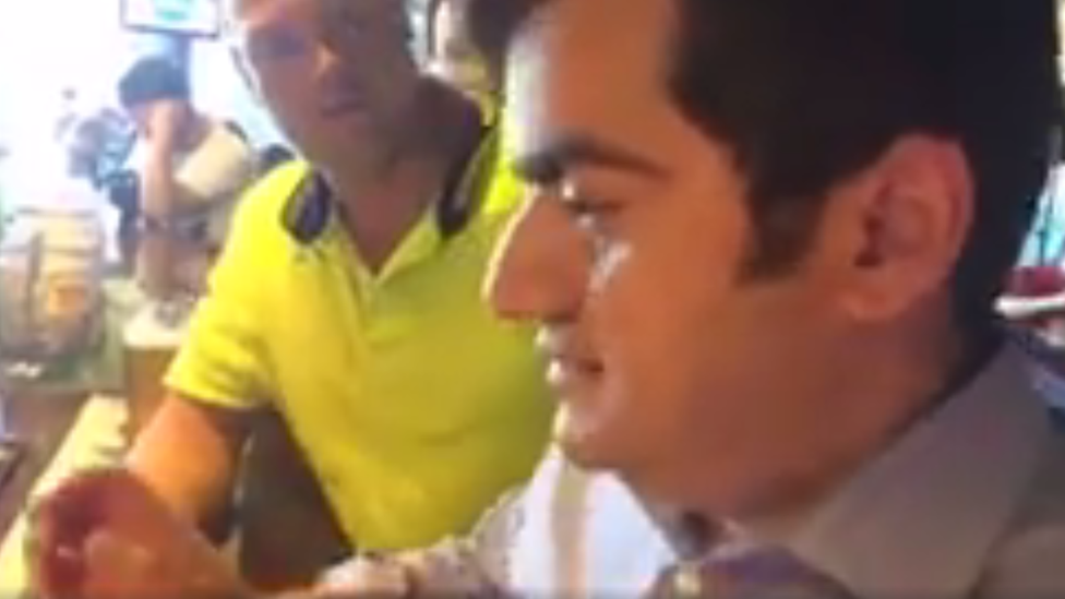 Sam Dastyari is confronted by a man at a bar