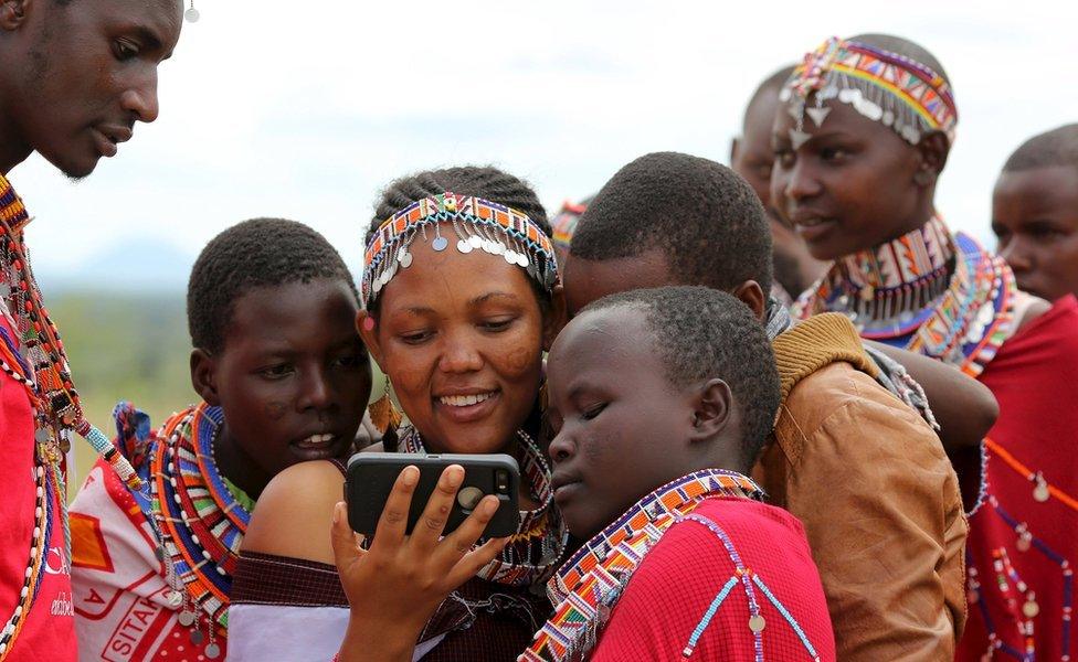 Ethiopian woman looking at phone