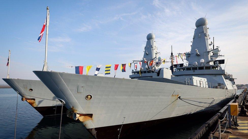 Ships at the naval yard dressed up with bunting to celebrate The Queen's birthday