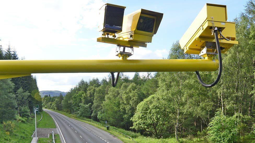 Close up of speed cameras, suspended above the A9 road