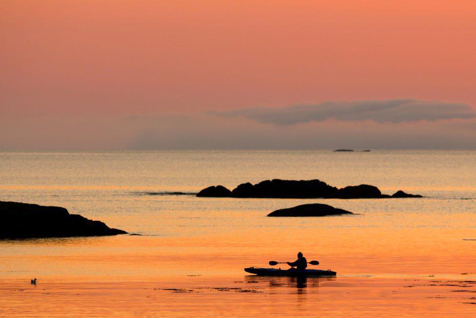 Kayaker at sunset off Mull