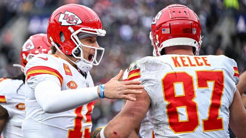 Kansas City Chiefs quarterback Patrick Mahomes celebrates with tight end Travis Kelce.