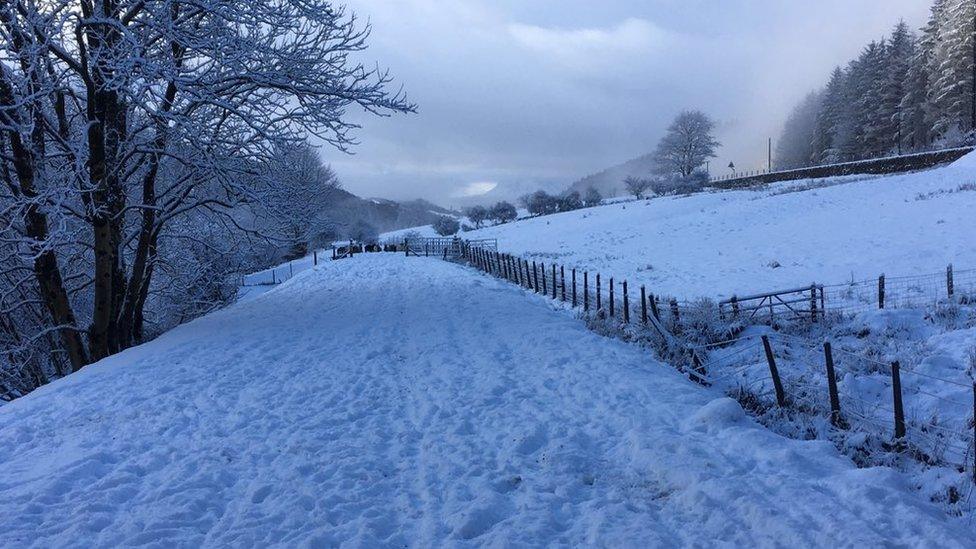 Cader Idris looms large in the background of this snowy north Wales scene