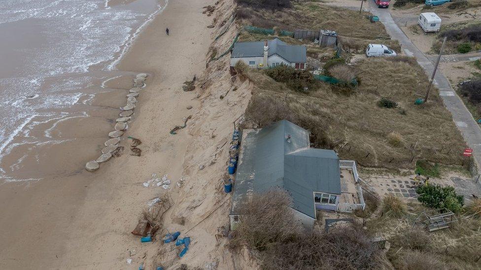 Drone shot of cliff-top chalets