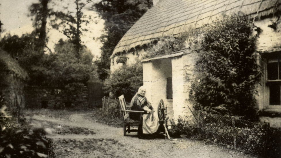 Woman with spinning wheel