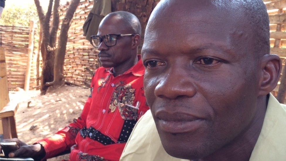 The feuding warlords, Gaetan in the foreground and Tarzan in red shirt, waiting to meet with Minusca deputy boss Diane Corner