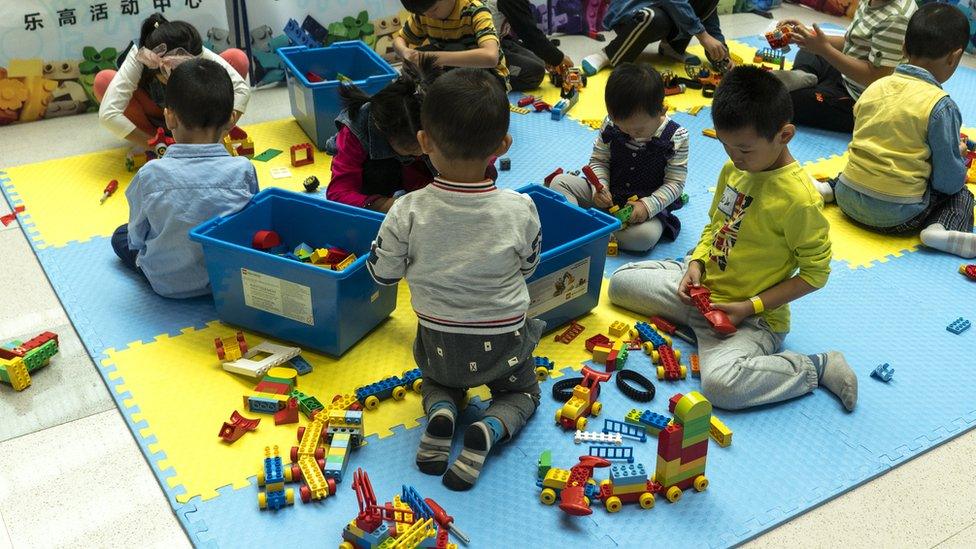 Children in China playing with plastic bricks