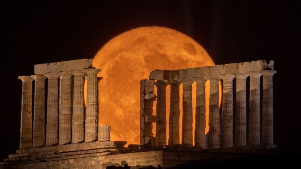 Buck Moon rising behind the Temple of Poseidon near Athens