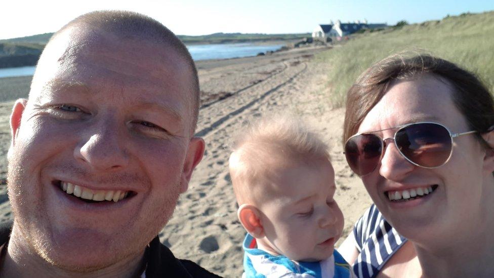 Shane Lewis with son Llewellyn and wife Laura