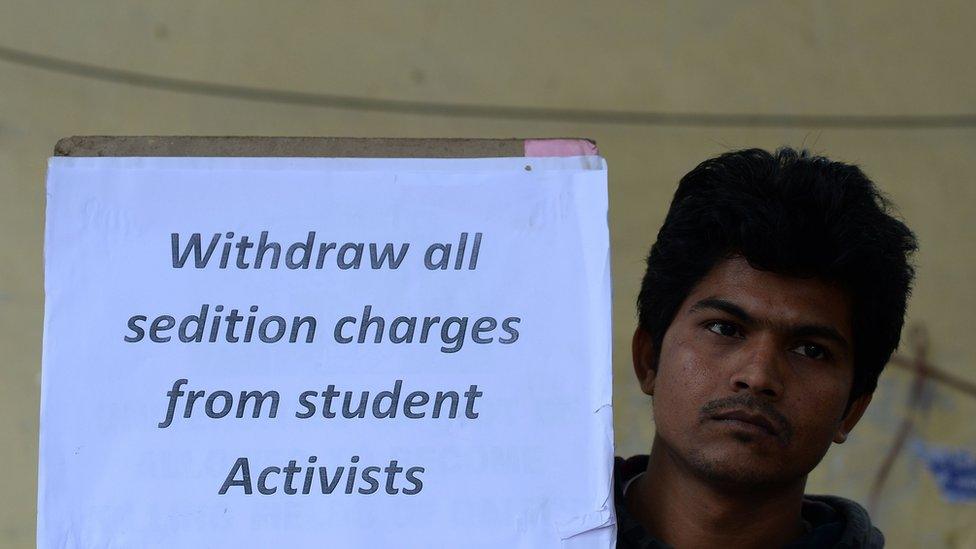 An Indian student holds a placard during a protest against the arrest of the president of Jawaharlal Nehru University's Student Union (JNU) Kanhaiya Kumar