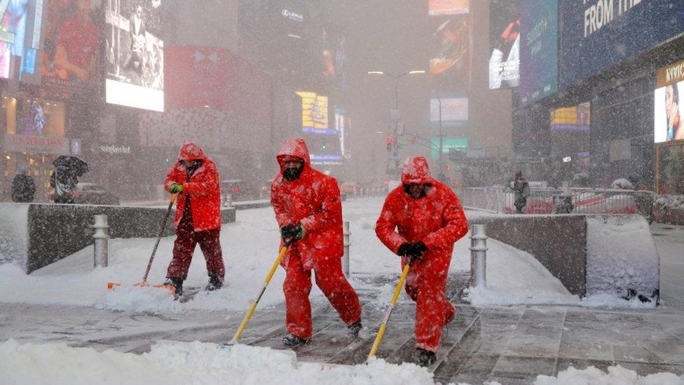 New York City workers clear snow in Times Square