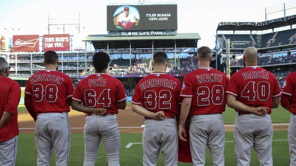 Los Angeles Angels players honour the memory of pitcher Tyler Skaggs before a game against the Texas Rangers