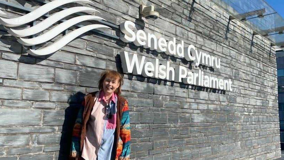 Tassia stood outside the Senedd