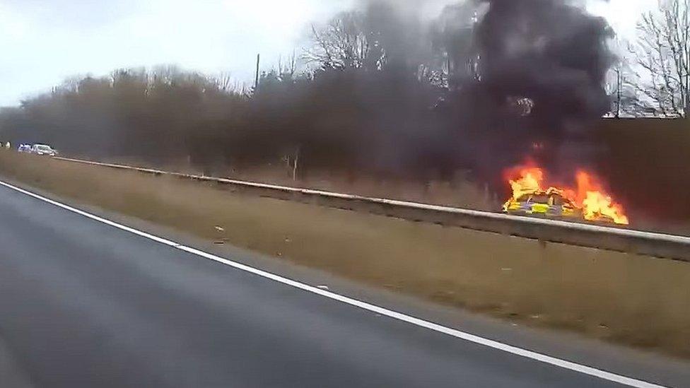 Norfolk Police car on fire on A11 Wymondham, Norfolk